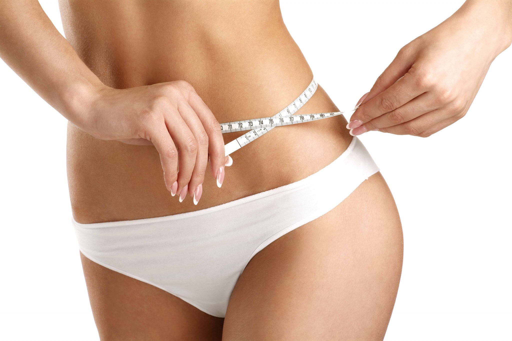 Closeup of a woman measuring her hips